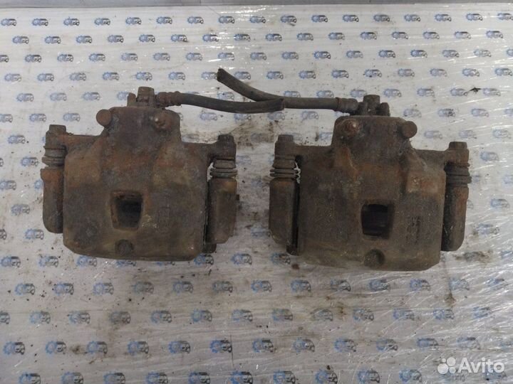 Суппорт передний Mazda 323 Bj