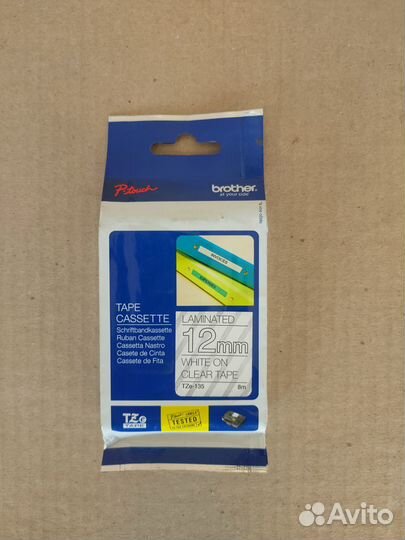 TZE135 Brother Наклейка 12 мм белый на прозрачном