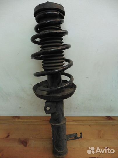 Стойка (амортизатор) в сборе левая Опель Астра J