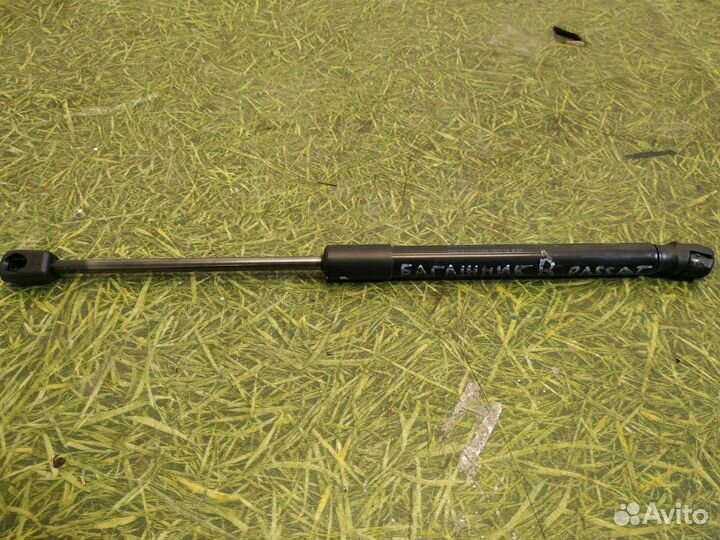 Амортизатор крышки багажника Volkswagen Passat B7