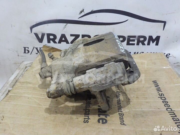 Суппорт тормозной передний левый Toyota Corona