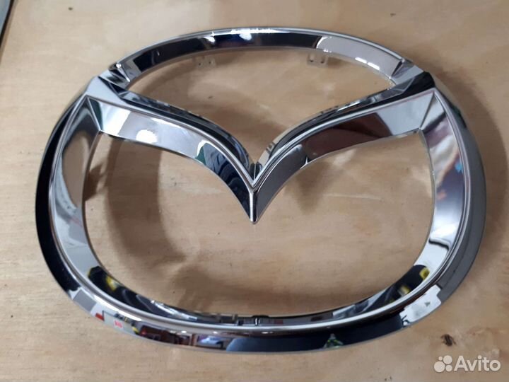 Эмблема mazda