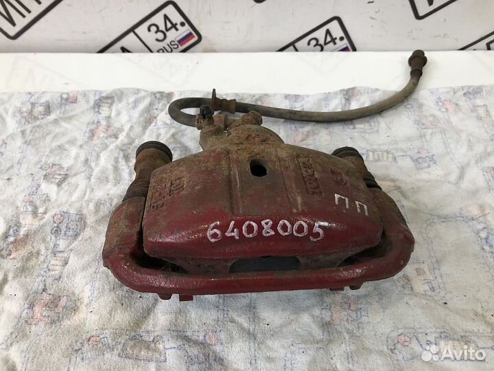 Суппорт тормозной передний Toyota Corolla E100