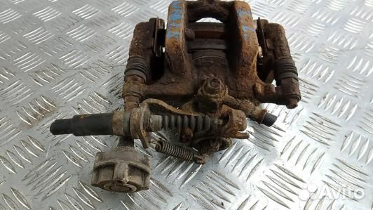 Суппорт тормозной задний левый opel astra J (NEA25