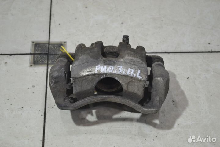 Тормозной суппорт передний левый Kia Rio 3