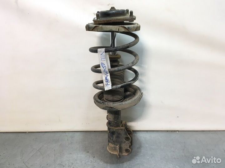 Стойка подвески передняя левая Mazda Familia седан