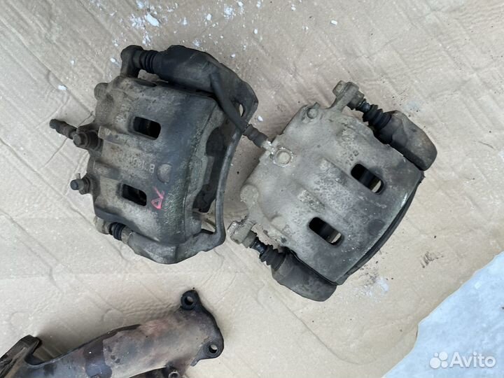 Суппорт передний Опель Антара