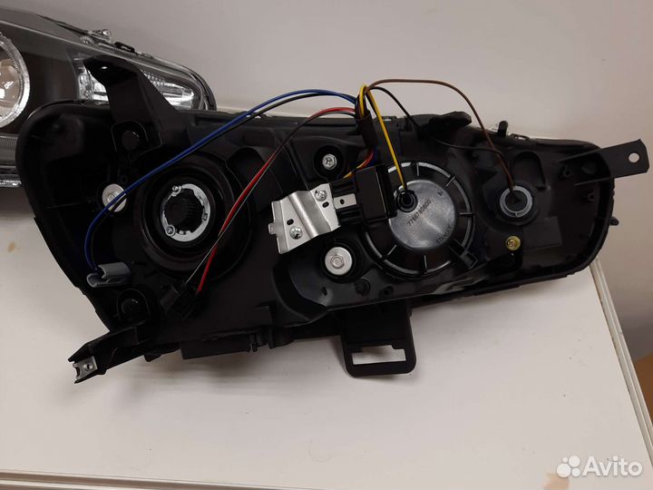 Фара левая Mitsubishi lancer 10