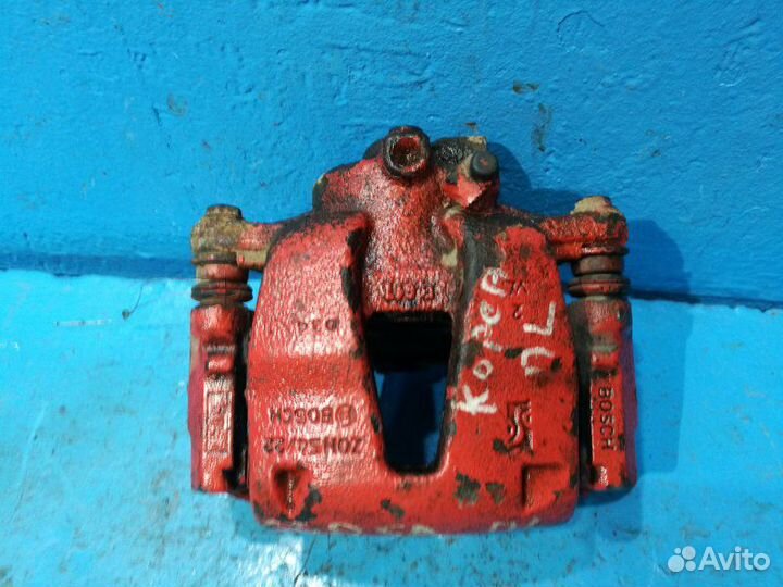 Суппорт передний левый Опель Корса Д