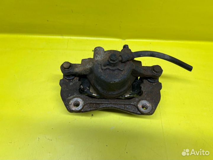 Суппорт тормозной передний левый Kia Forte седан