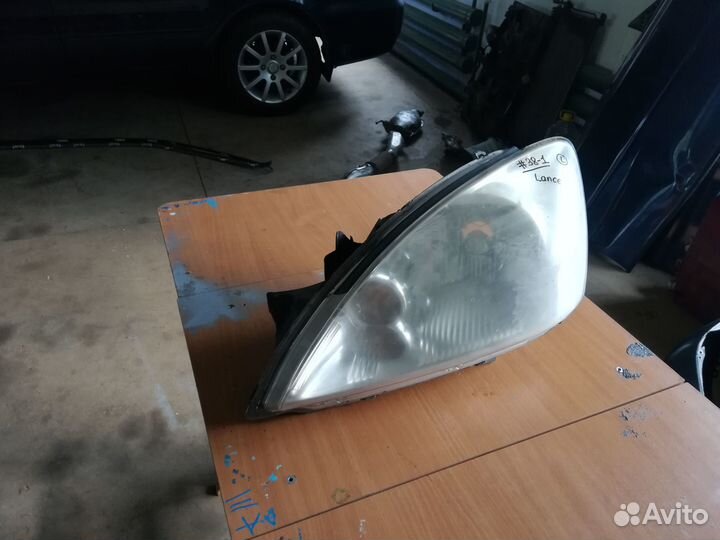 Фара передняя левая Mitsubishi Lancer 9