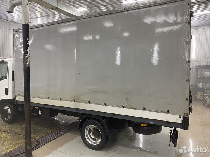 Тентованный грузовик Isuzu Elf (N-series), 2014