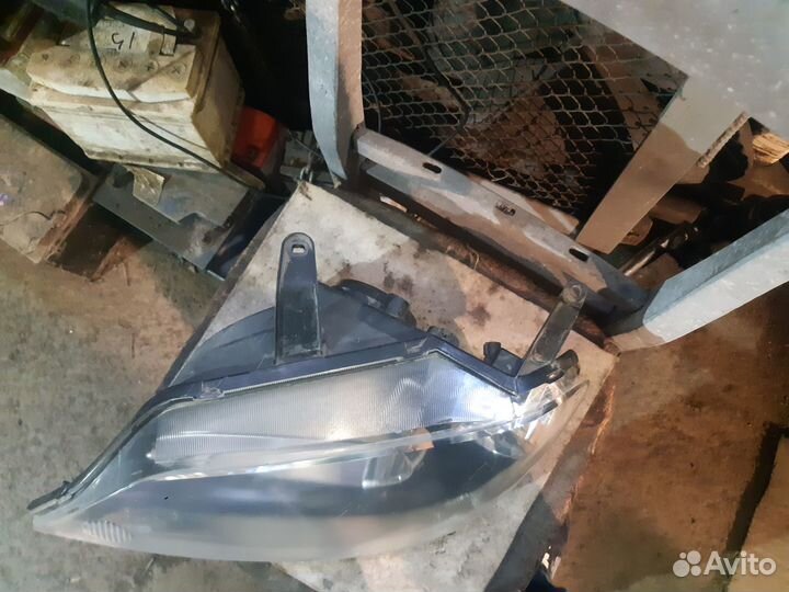 Фара mazda demio