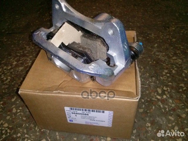 Суппорт тормозной задний правый 96800086 genera