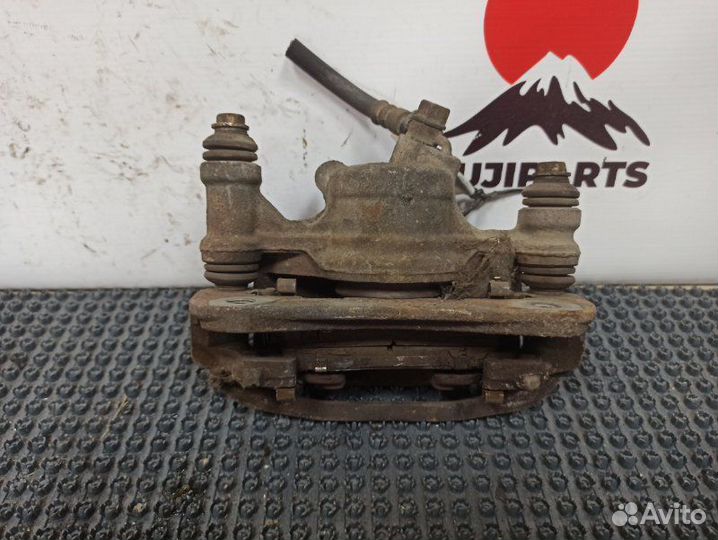 Суппорт тормозной задний левый Toyota Corsa EL51