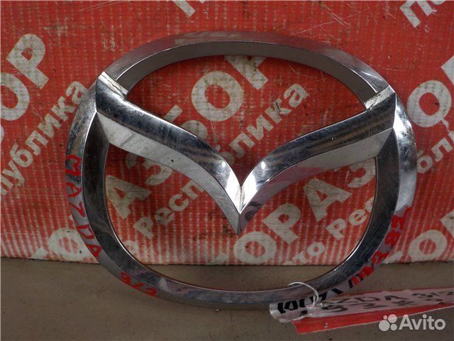 Эмблема передняя Mazda 3 BL Z6 2010
