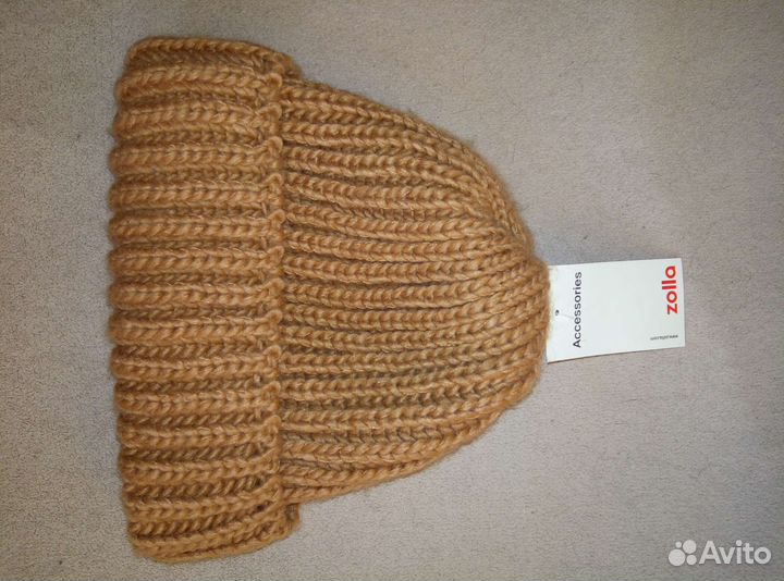 Новая шапка Твое, Zolla