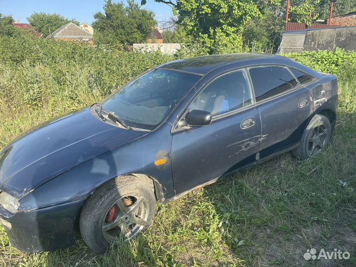 Двери передние mazda 323f