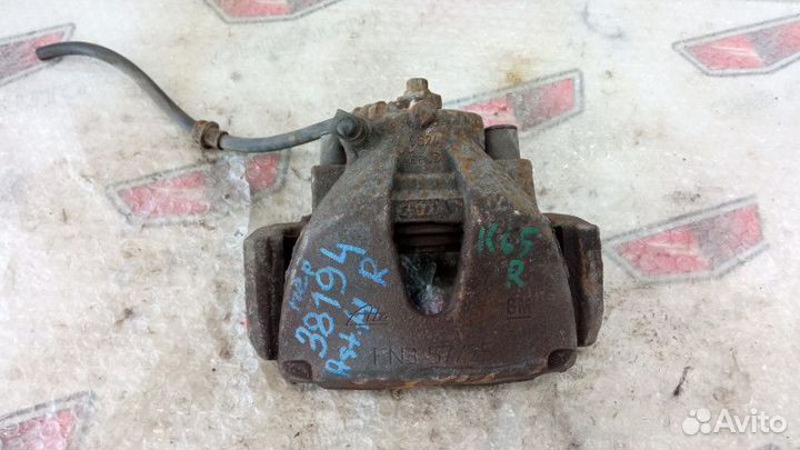 Суппорт тормозной передний правый Опель Астра Н