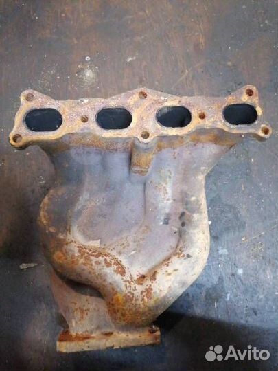 Коллектор выпускной Mazda Familia ZL