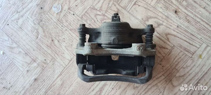 Суппорт тормозной. Nissan Sunny