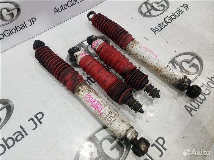 Амортизатор/стойка задняя левая Mazda Proceed Marvie