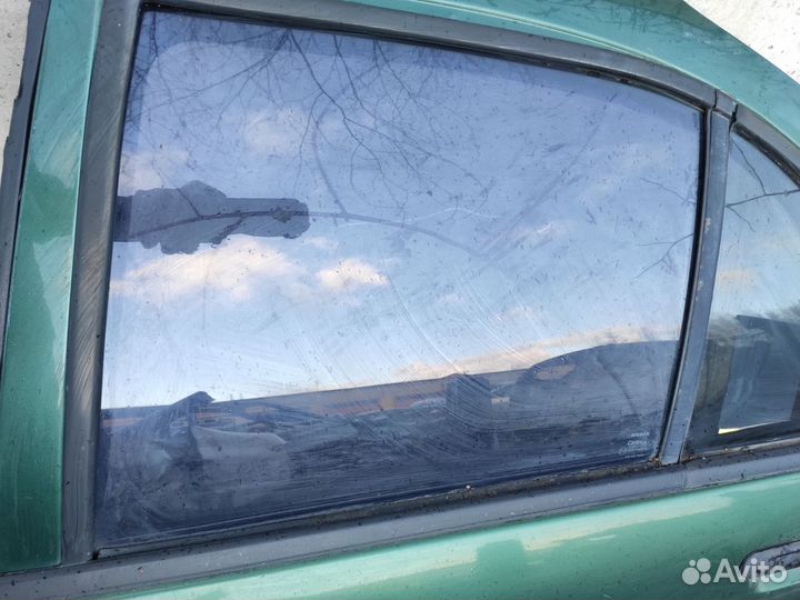 Стекло дверное заднее левое Nissan Almera N15