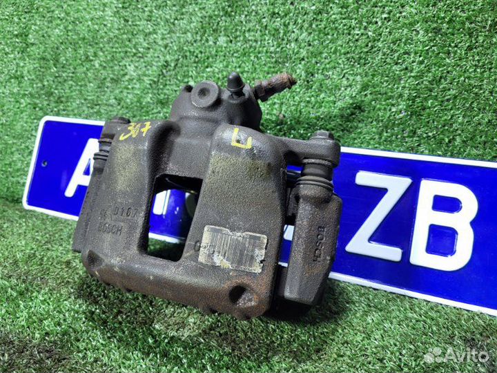 Суппорт тормозной передний левый Peugeot 307 Sw