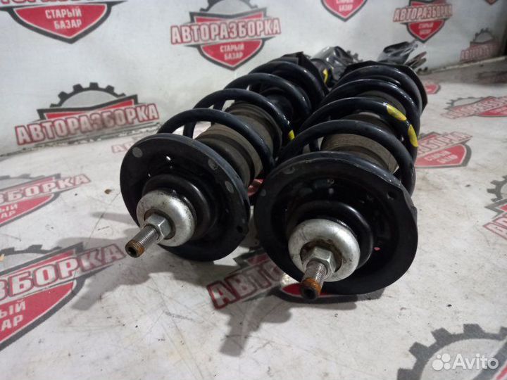 Стойка передняя Nissan March K13 HR12DE 2011