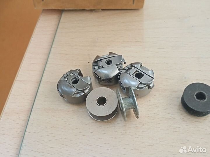 Шпульки и шпулькадержатель