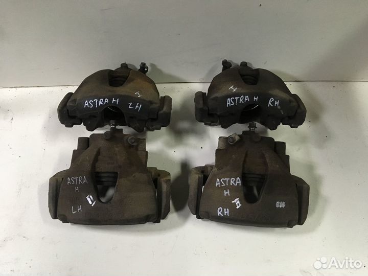 Тормозной суппорт левый Opel Astra H