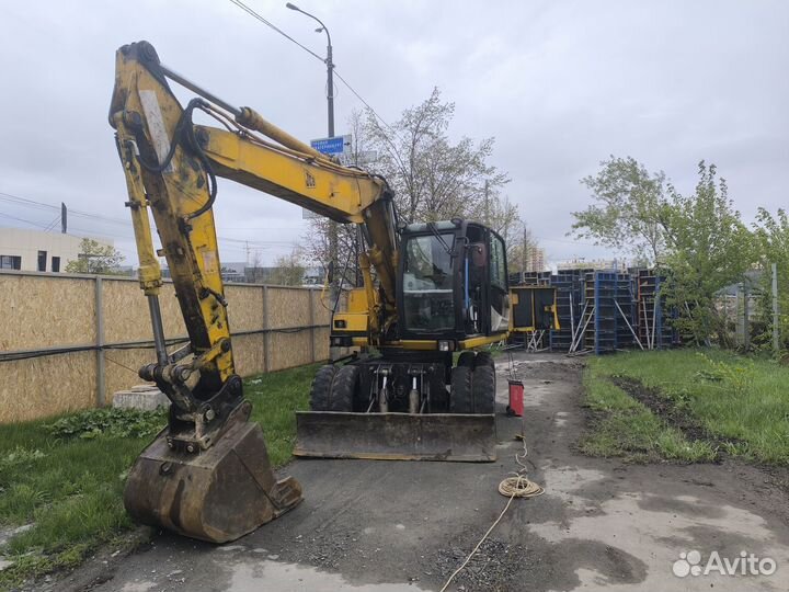 Машинист колесного экскаватора