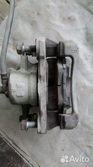 Супорт тормозной передний Toyota Corolla E150