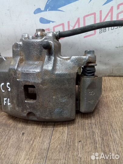 Суппорт тормозной передний левый Mitsubishi Lancer