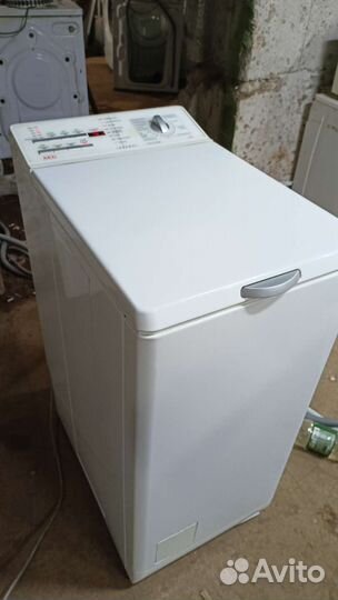 Стиральная машина AEG с вертикальной загрузкой