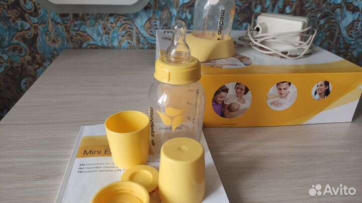 Молокоотсос medela электрический