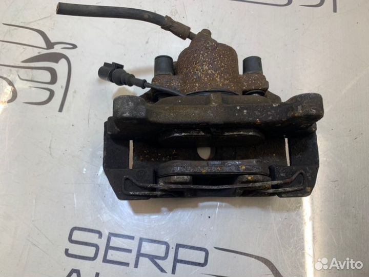 Суппорт передний левый Volkswagen Passat B6 2.0