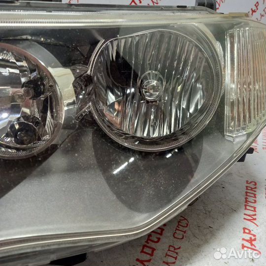 Фара ксеноновая передняя левая Mitsubishi
