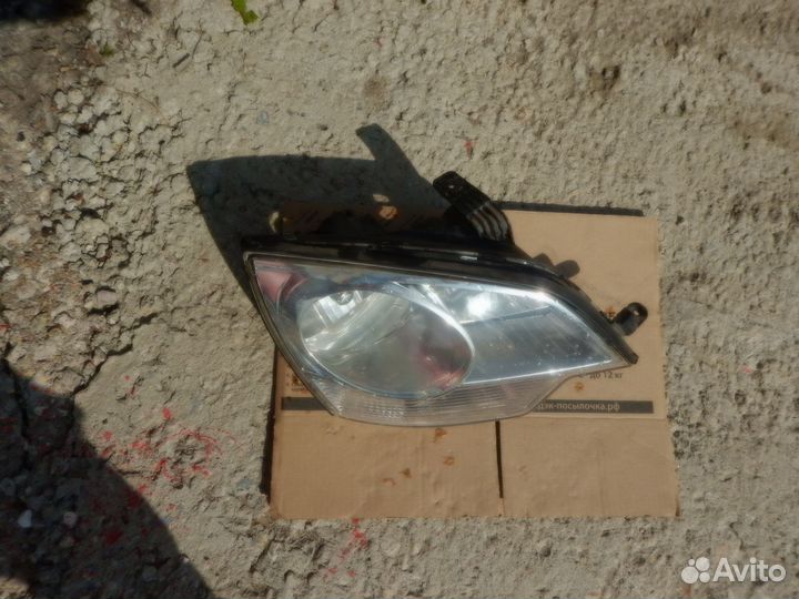 Стекло фары правой Opel Antara