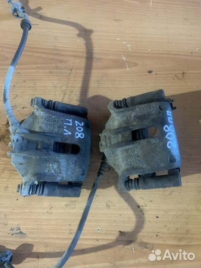 Суппорт тормозной передний левый Peugeot 208