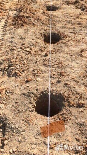 Бурение ям под столбы забора