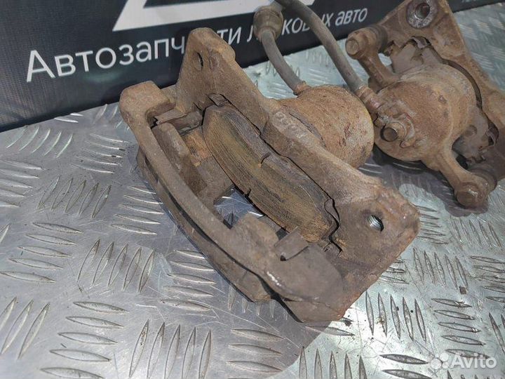 Суппорт левый Chevrolet Aveo T250 1.2