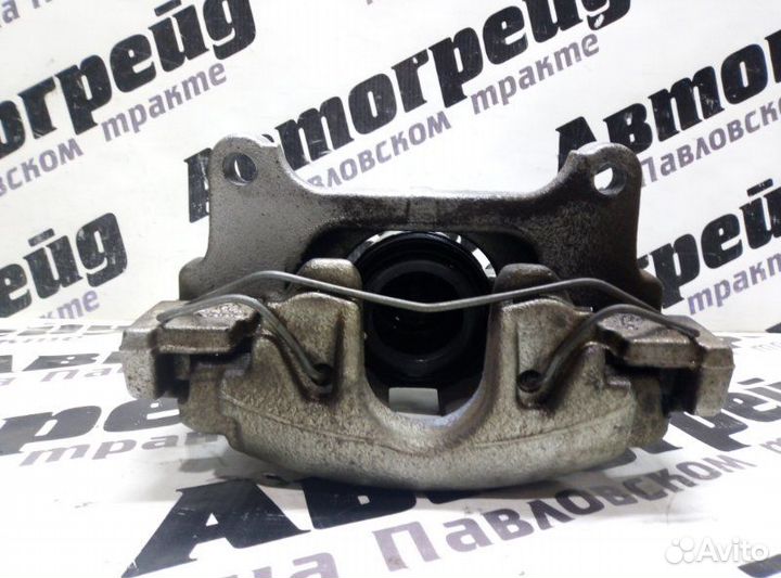 Суппорт тормозной передний левый Volkswagen Passat