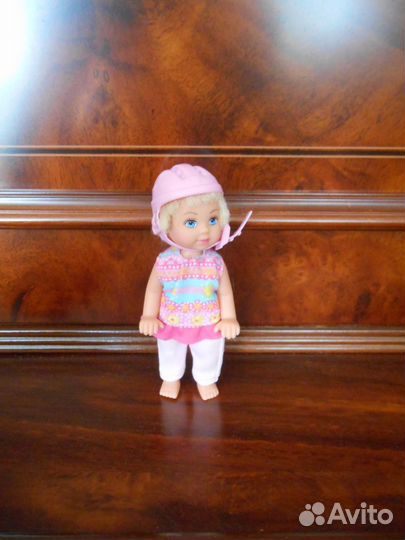 Кукла с велосипедом