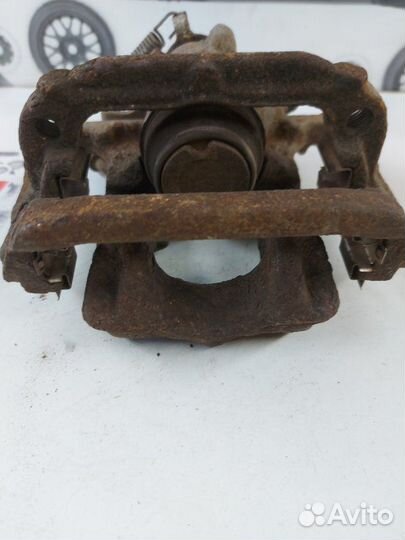 Суппорт тормозной задний левый Opel Mokka