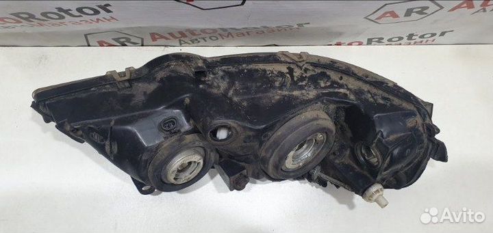 Фара галогеновая левая Opel Astra седан