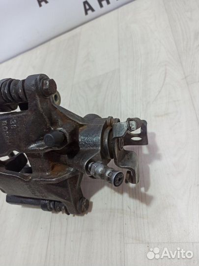 Суппорт тормозной задний левый Ford Mondeo