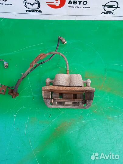 Суппорт тормозной передний Opel Antara