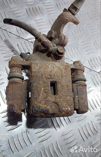 Суппорт тормозной задний правый Kia Cerato седан