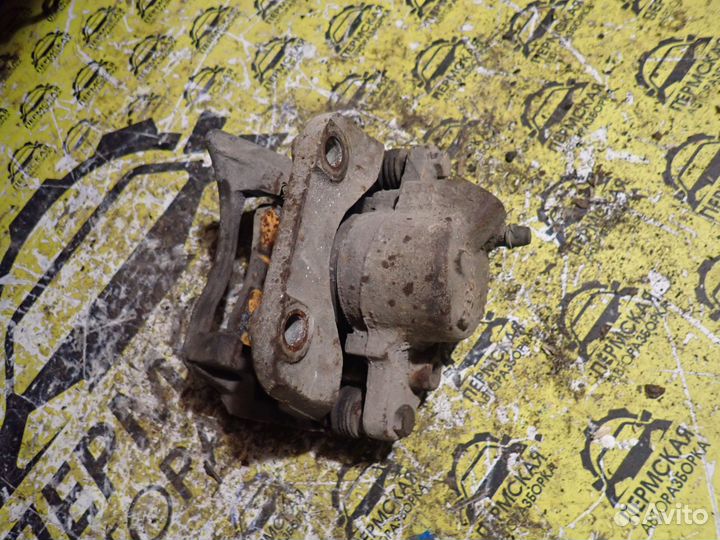 Суппорт тормозной передний левый Renault Logan 1